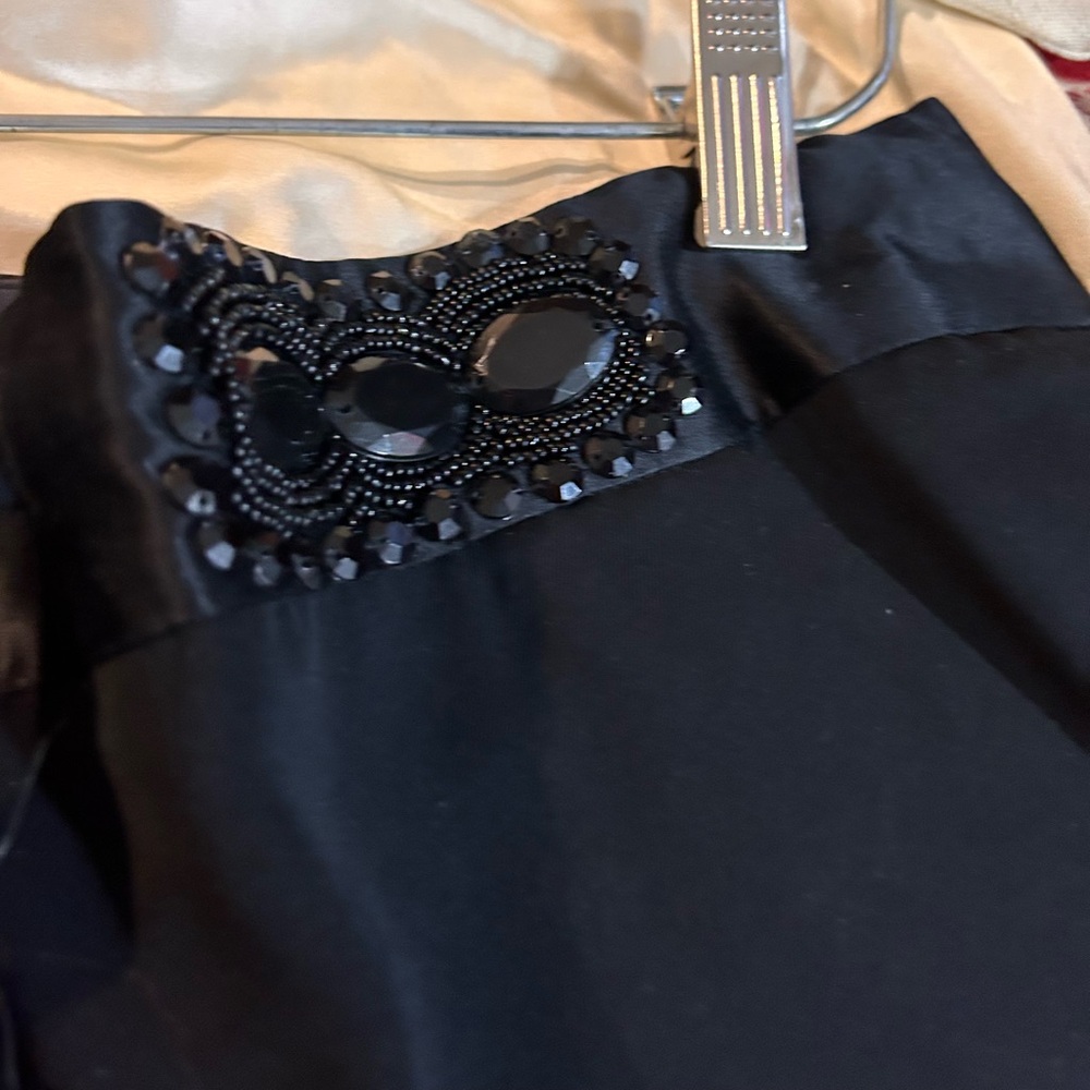 Really cool long shorts with cuffs and pockets!  Black with jeweled waist.